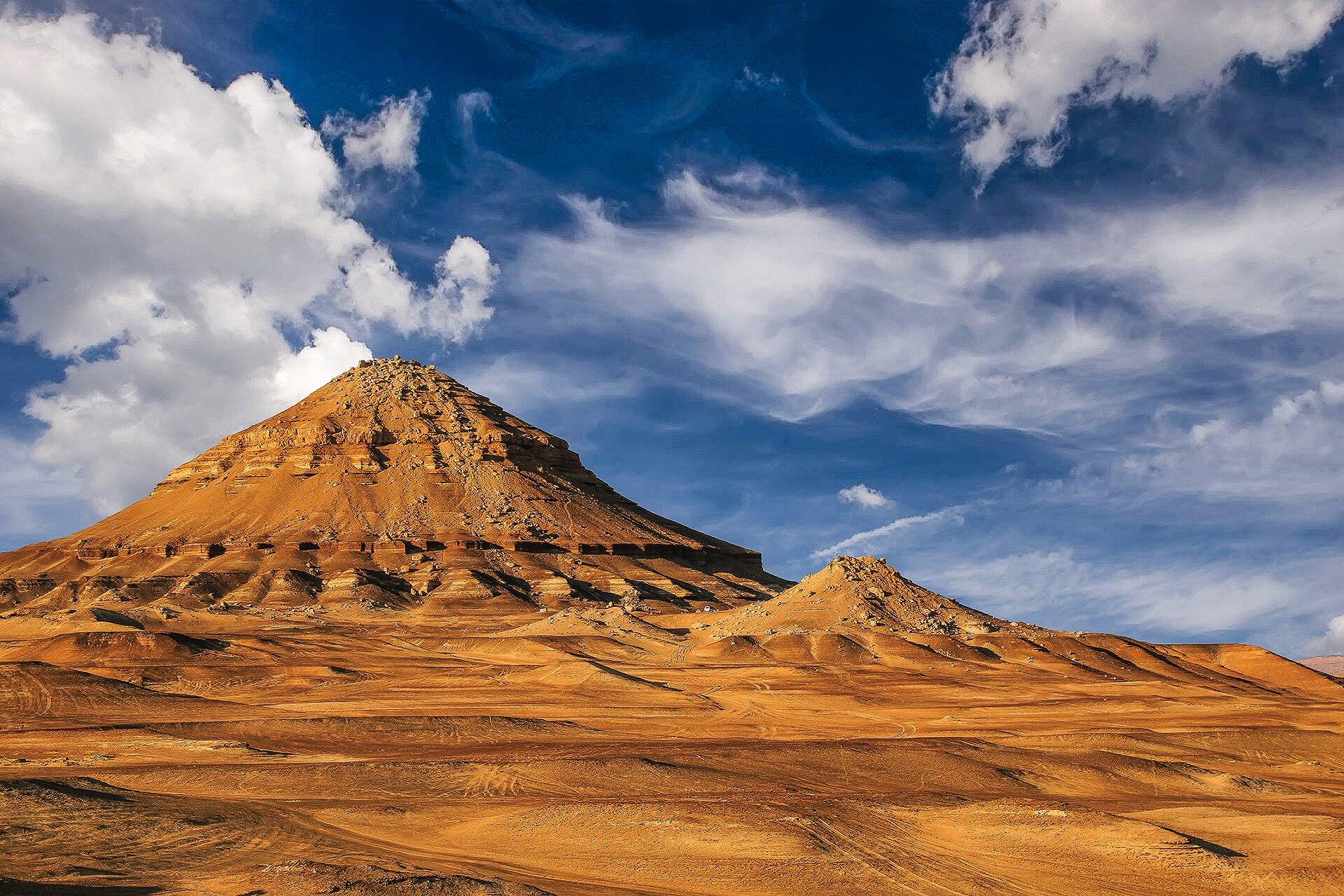 Gebel el Dist, a conical hill in the northern Bahariya Oasis whose flanks expose the type section of the Bahariya Formation