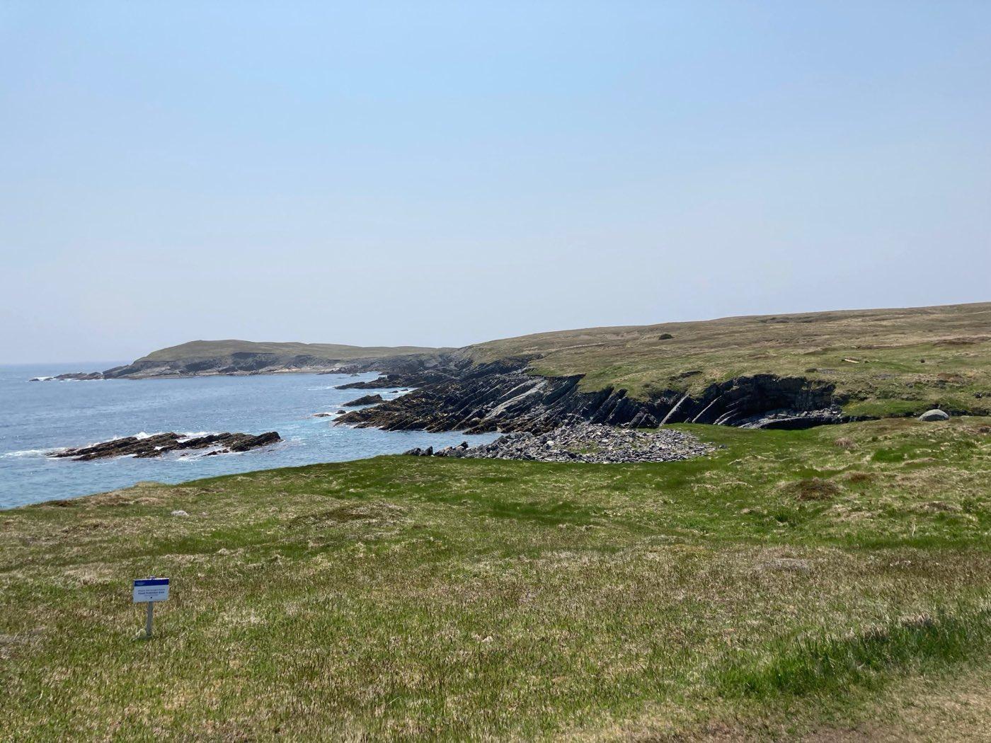 Rocky coastal barrens meeting the open sea at Mistaken Point, Newfoundland.