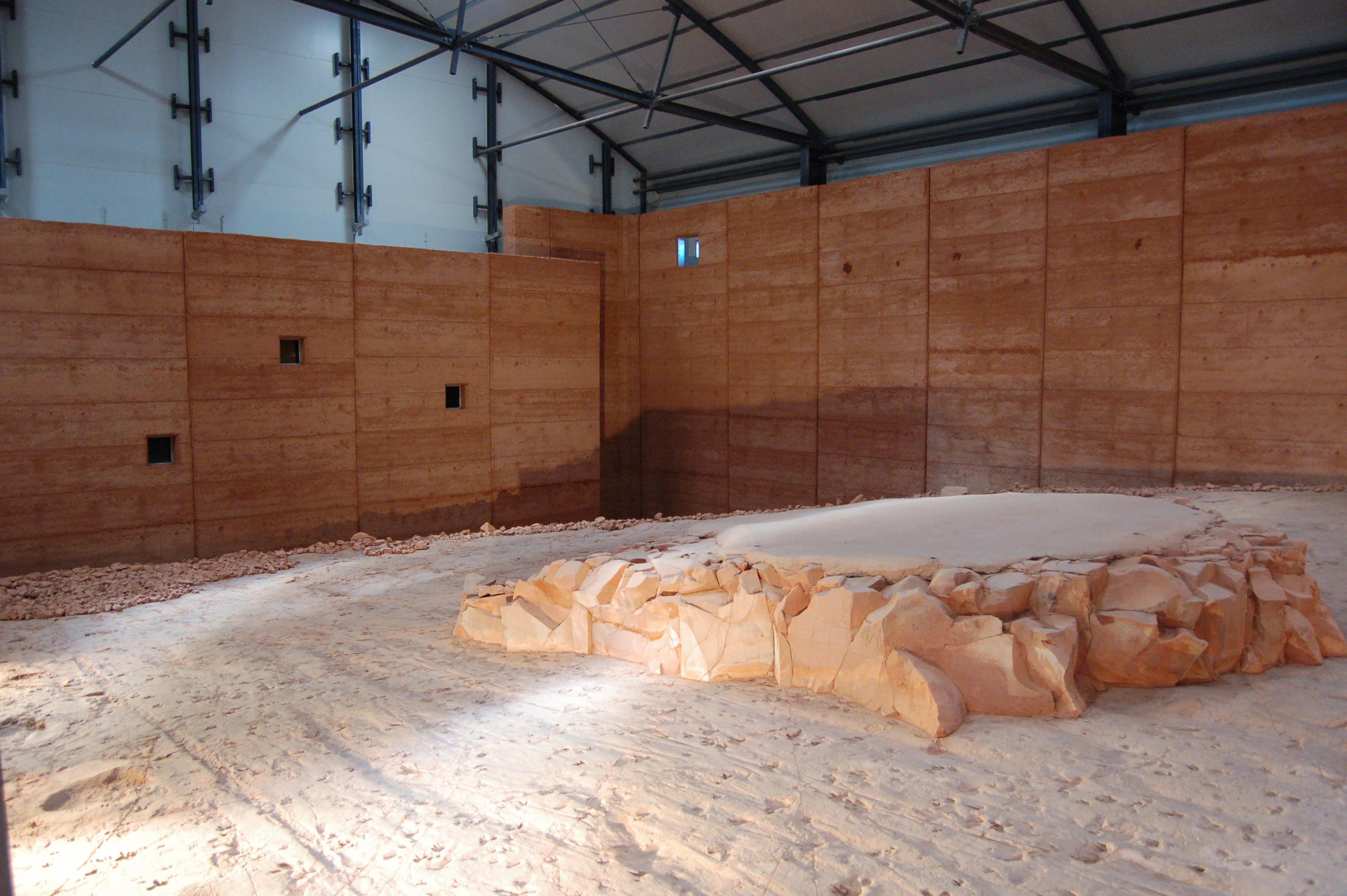 Interior of the shelter building at Lark Quarry with the central rock platform of dinosaur trackways exposed.
