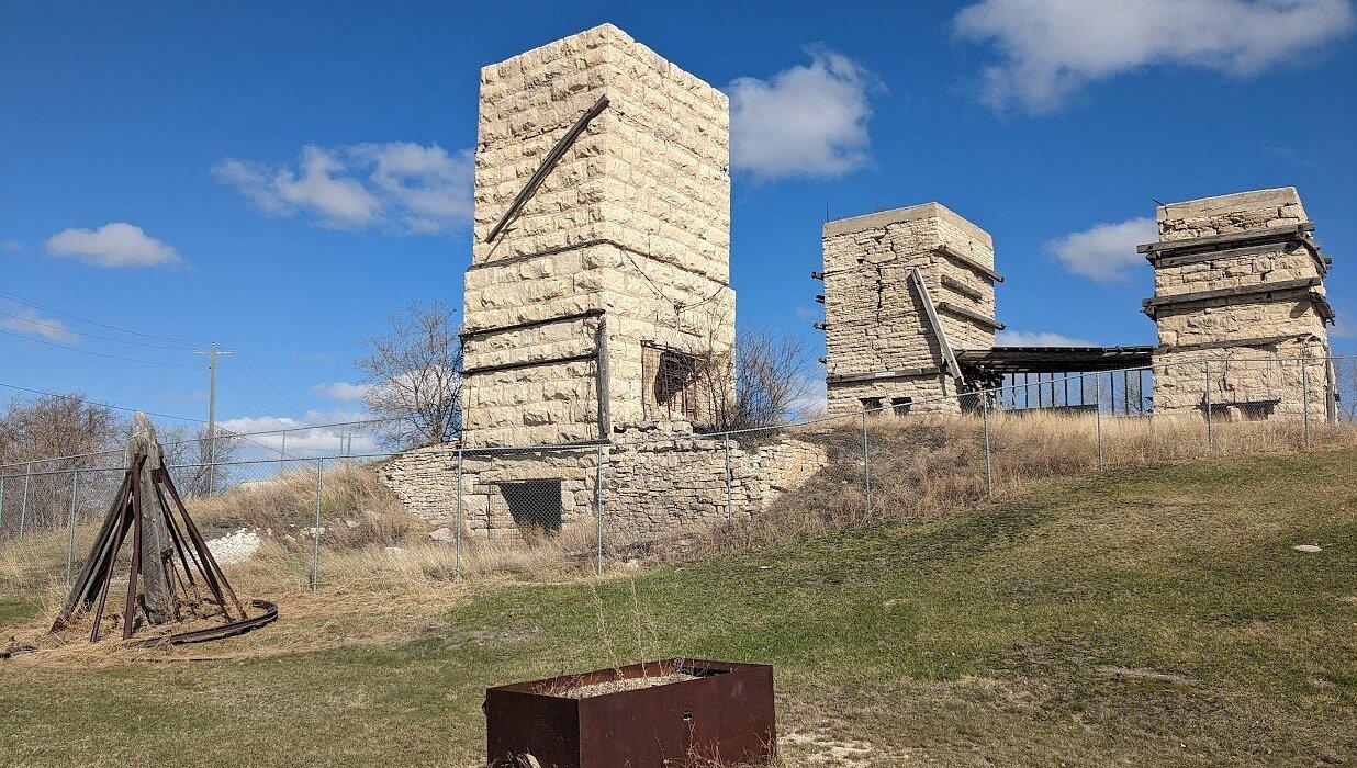 The Red Pit at Stonewall Quarry Park in Manitoba, with stacked limestone walls of the uppermost Ordovician Stonewall Formation rising above the quarry floor.