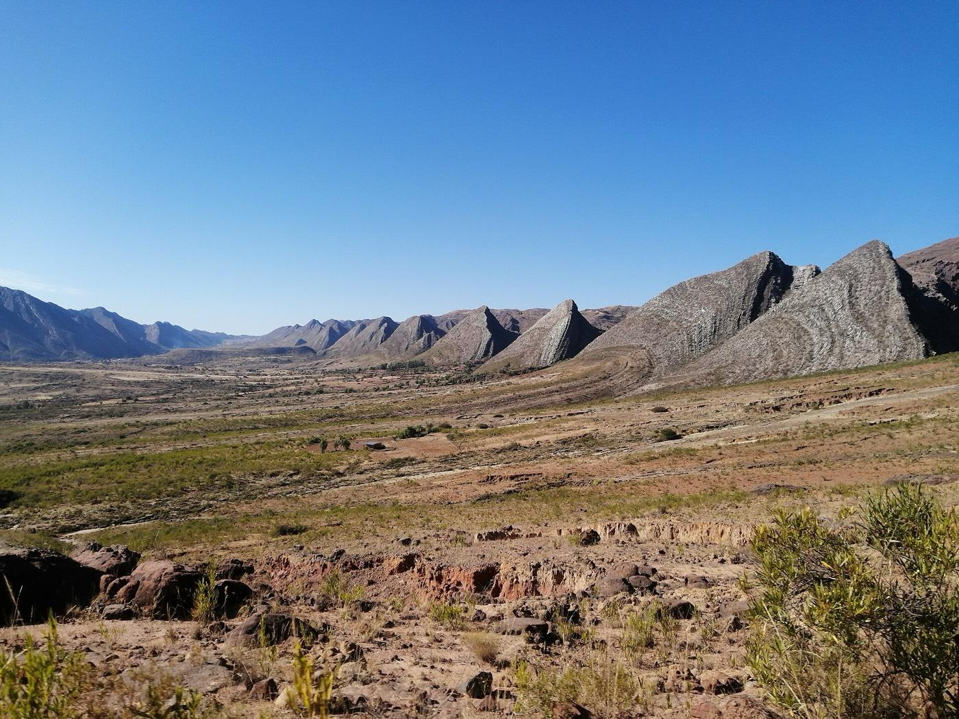 Steeply tilted rock formations in Torotoro National Park under a clear sky