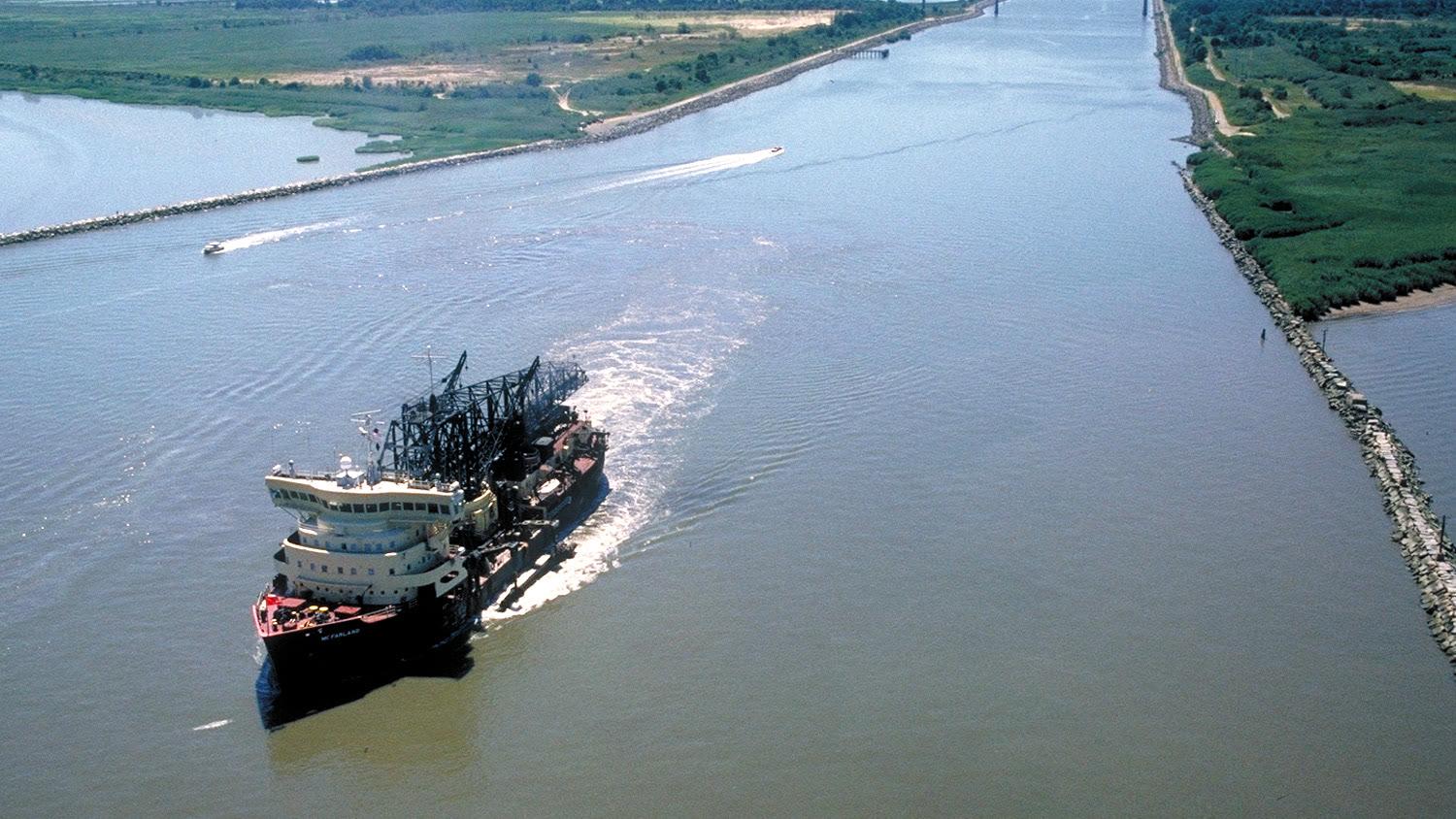The eastern entrance of the Chesapeake and Delaware Canal seen from the air with a ship under way