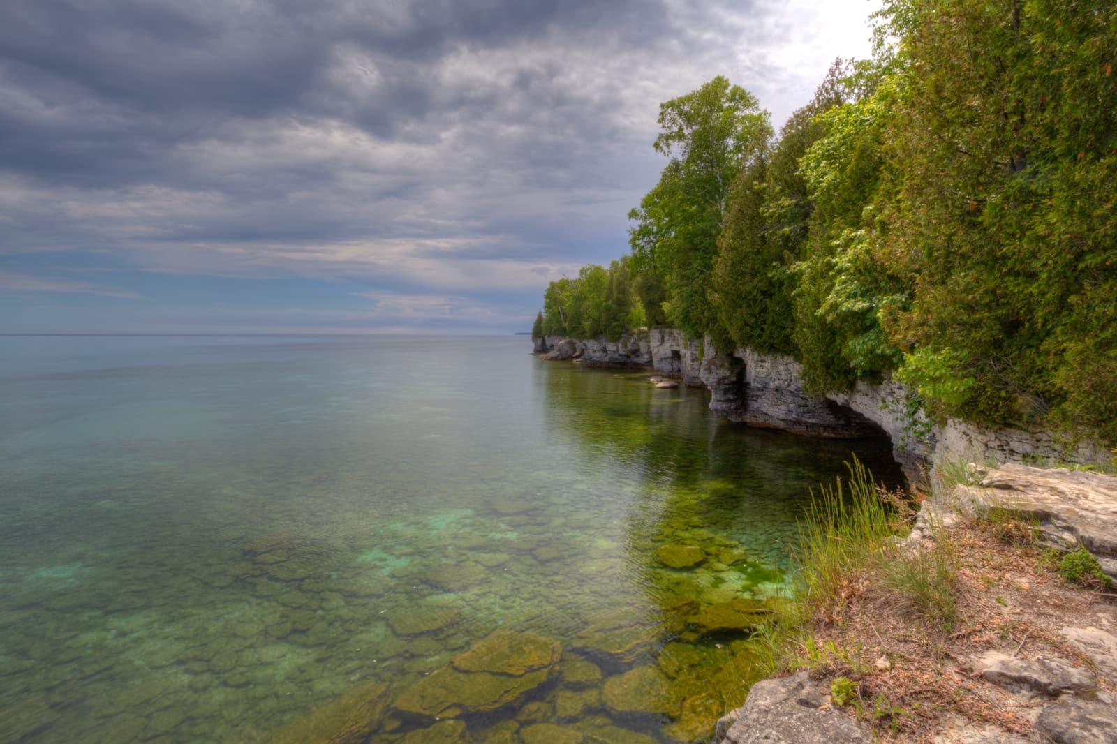 Dolomite ledges of the Niagara Escarpment meeting Lake Michigan at Cave Point, Door County, Wisconsin.