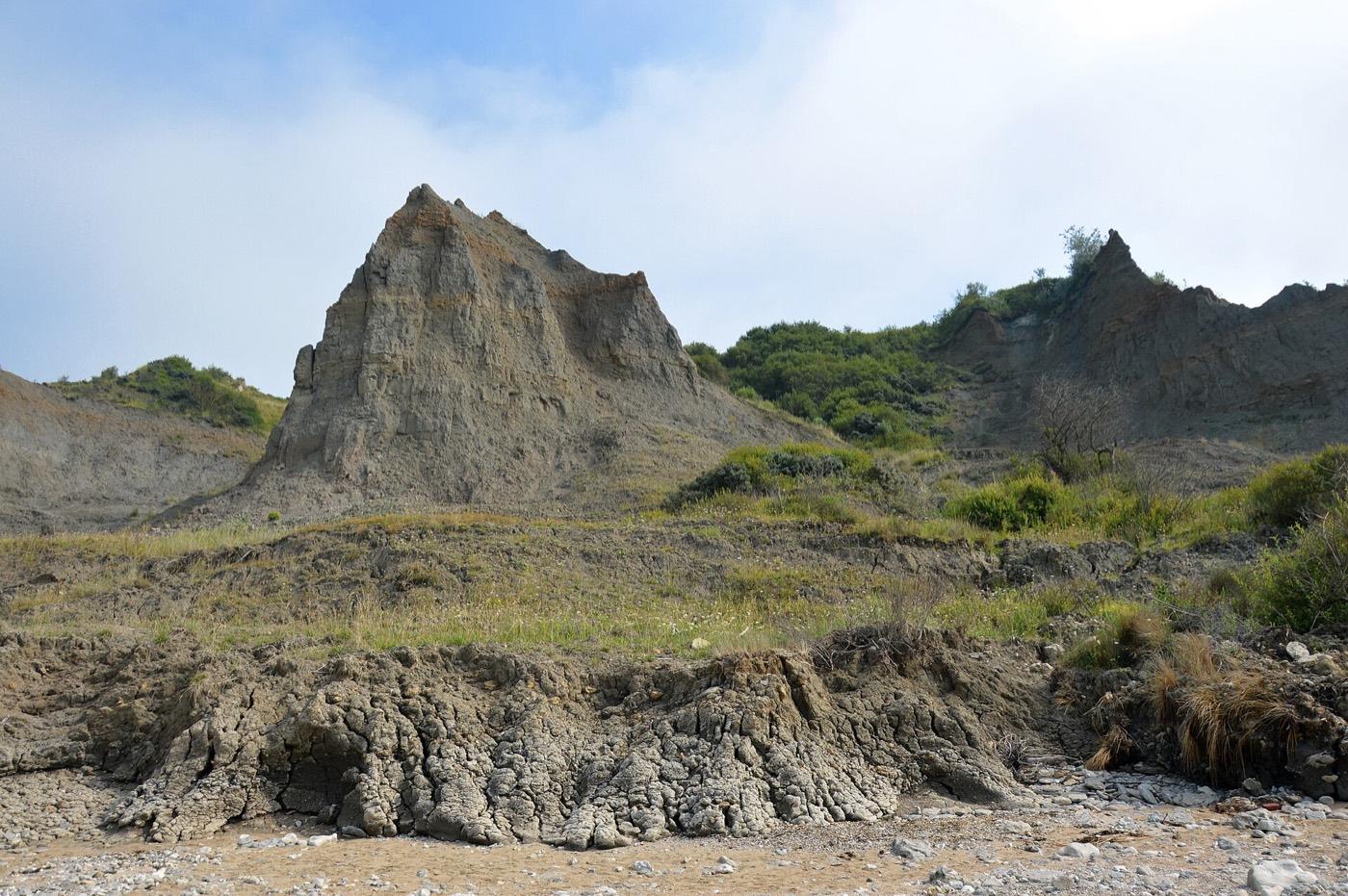 Slumped dark clay cliffs of the Vaches Noires seen from below at Gonneville-sur-Mer