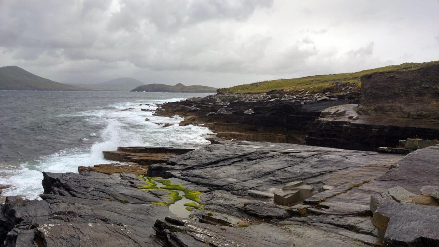 Rough tilted bedrock on the foreshore beside the tetrapod trackway on Valentia Island