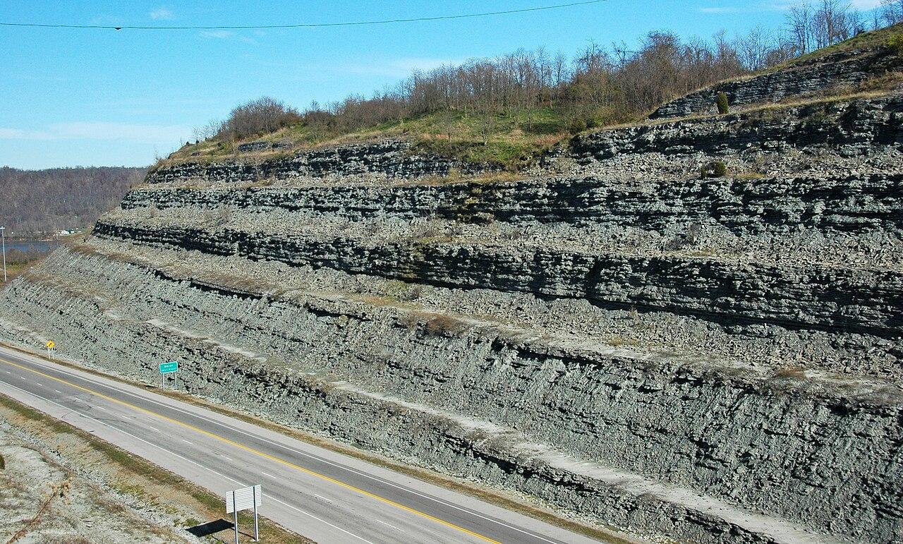 Thinly interbedded limestone and shale of the Kope Formation stepping up a roadside exposure in Ohio