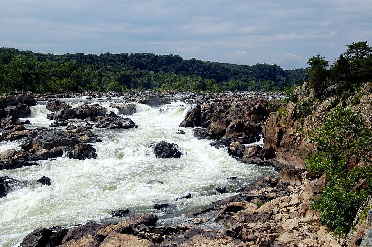 The Potomac breaking white over dark rock ledges below the cliffs at Great Falls, Maryland