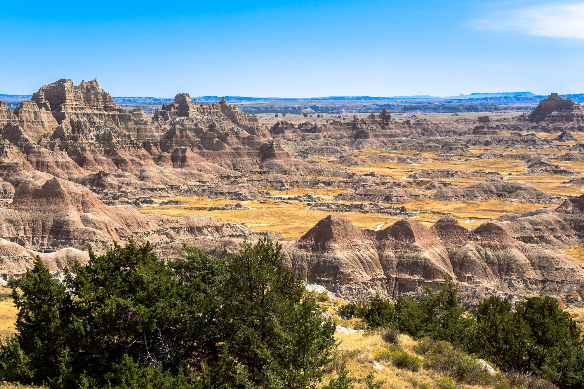 Eroded multicoloured buttes and gullies of the White River Badlands stretching to the horizon, South Dakota.