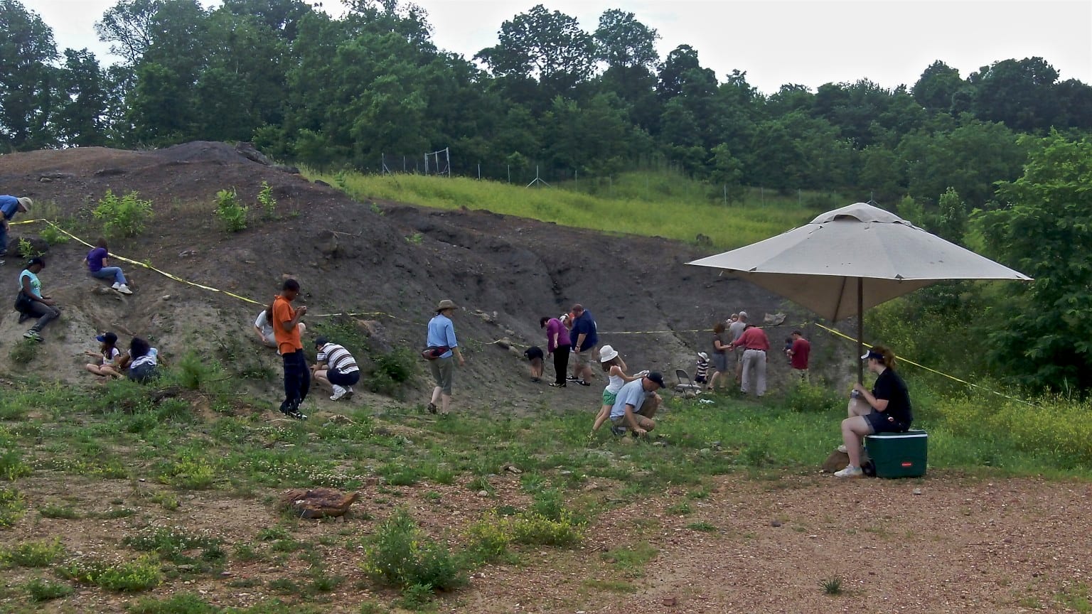 Visitors searching for fossils on the exposed Arundel Clay at Dinosaur Park in Laurel, Maryland.