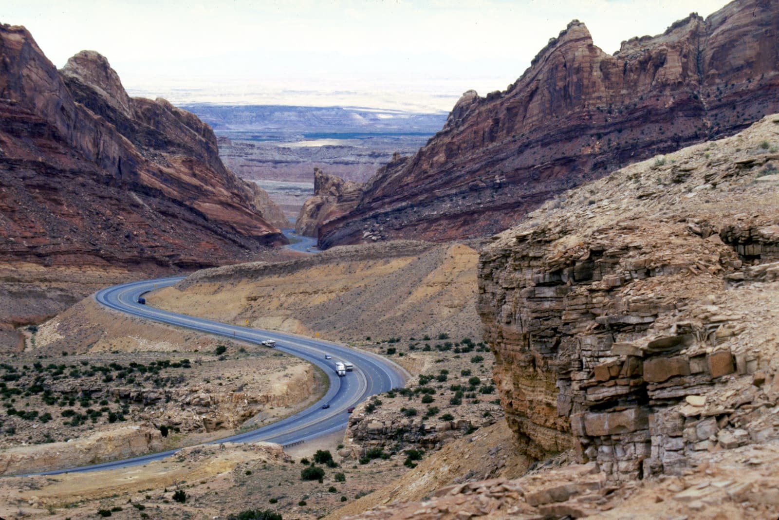 Interstate 70 cutting through the tilted rock layers of the San Rafael Swell, Utah.